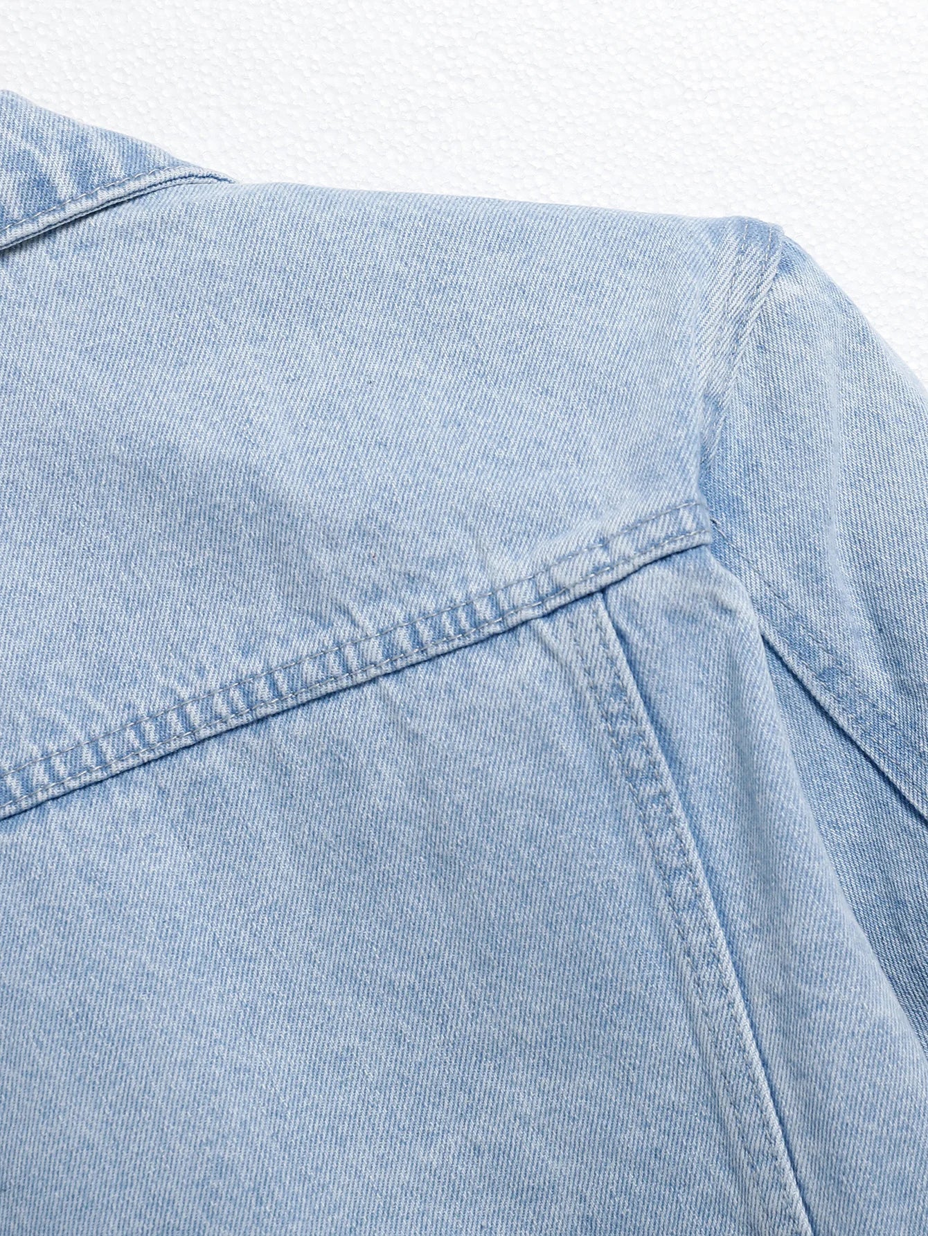 Men's light blue ripped denim jacket. Stylish and trendy. Street casual.