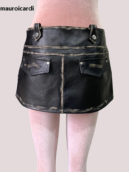 Mauroicardi Summer Distressed Black Pu Leather Mini Asymmetrical Skirts for Woman High Waist Short Emo Clothes New Arrivals 2025